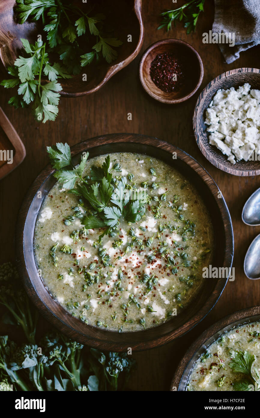 A bowl of broccoli and Feta cheese soup is photographed from the top view. Stock Photo