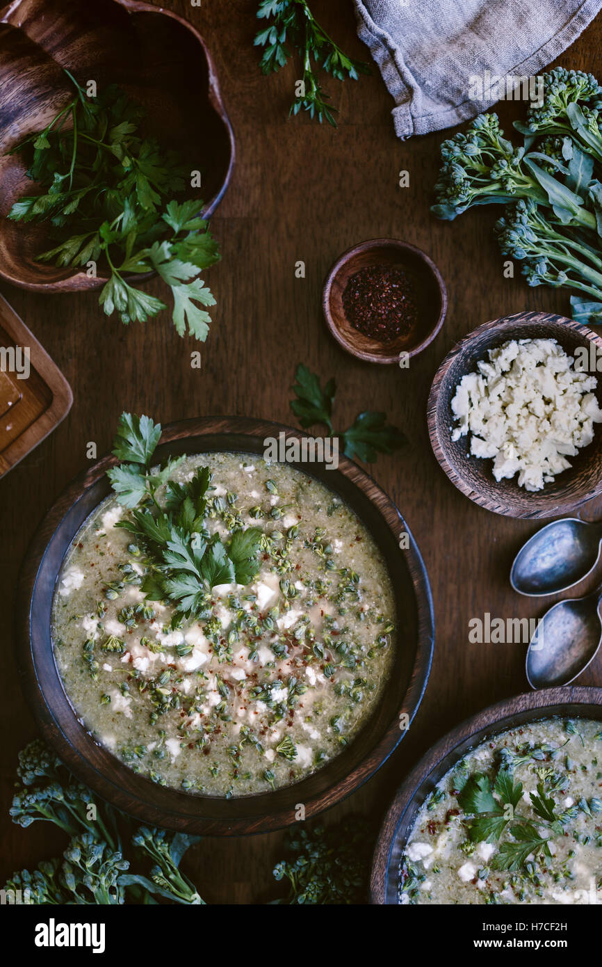 A bowl of broccoli and Feta cheese soup is photographed from the top view. Stock Photo