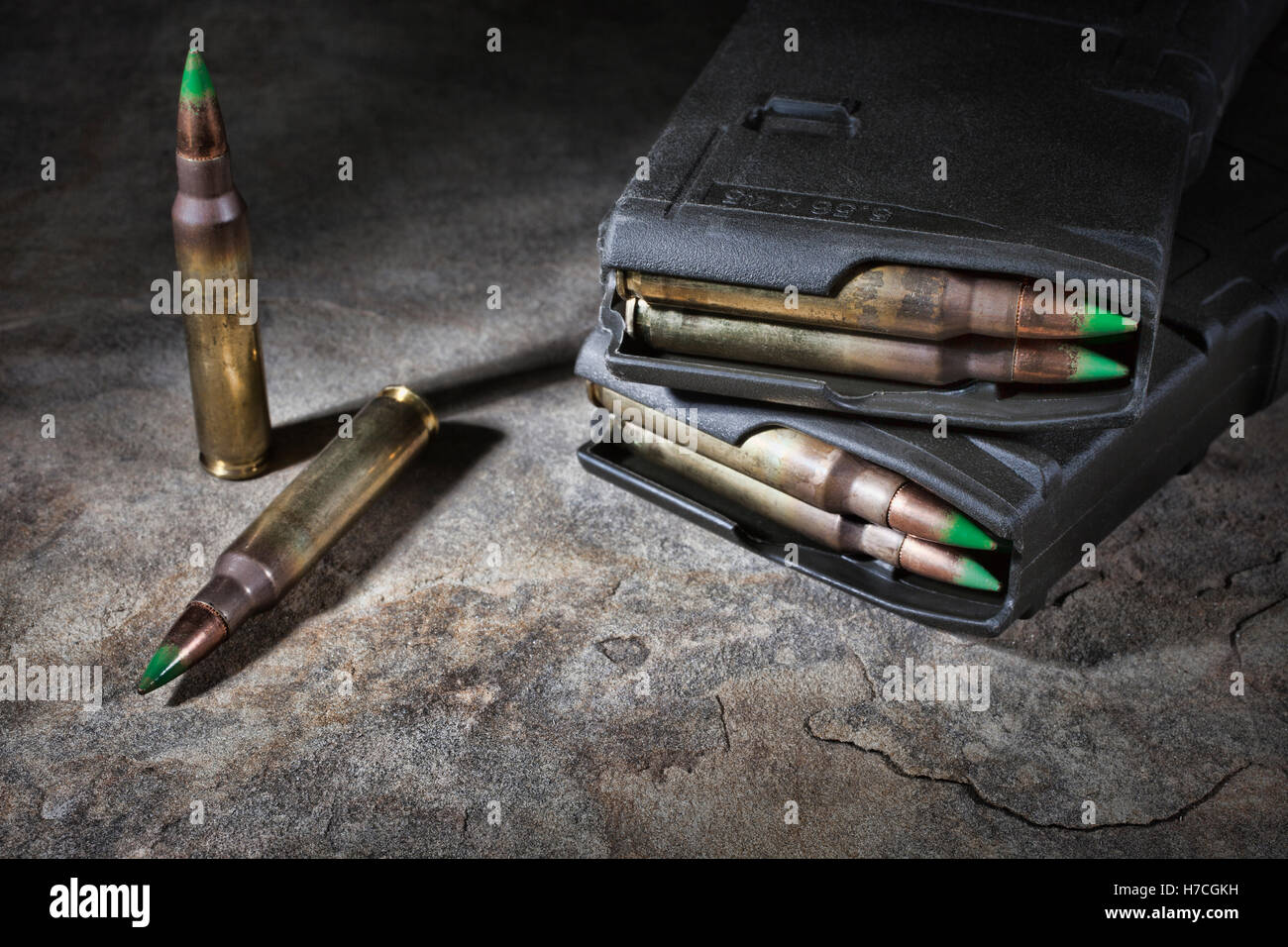 Two loaded magazines and cartridges with a green tipped bullet Stock ...
