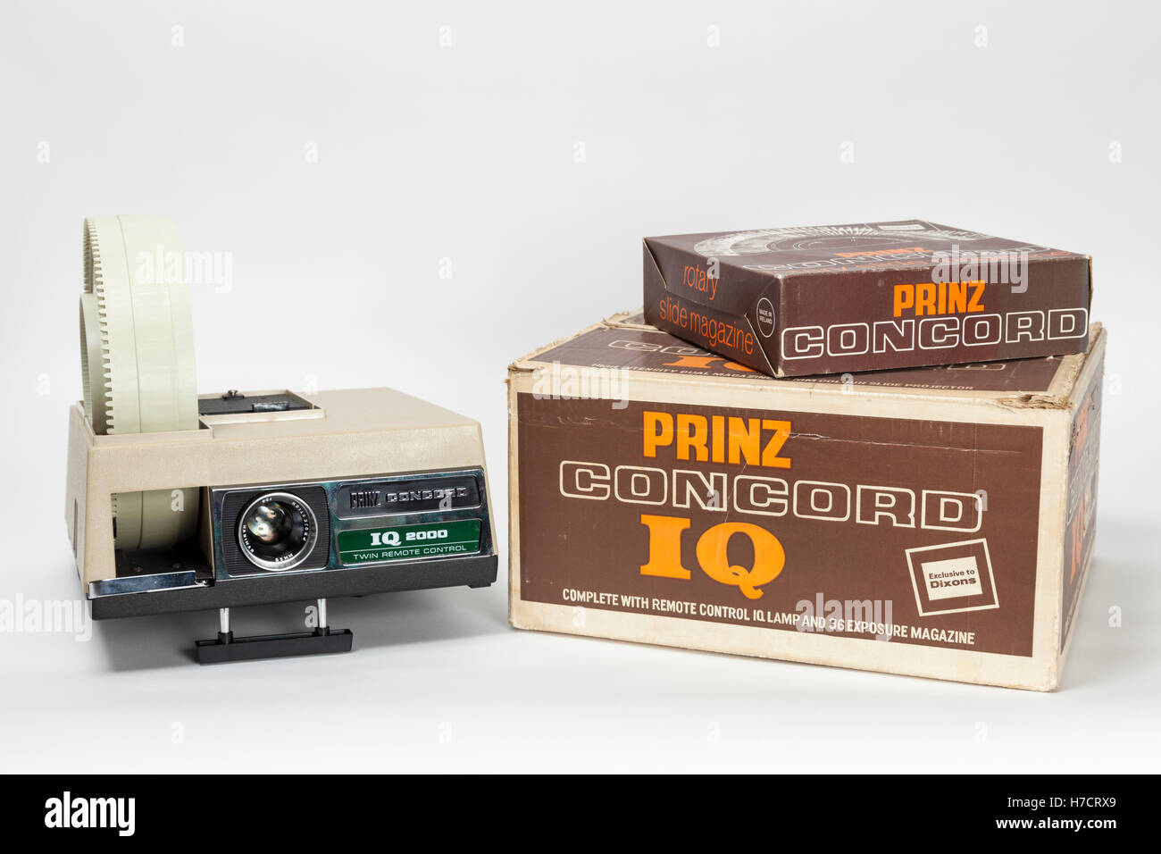 Dixons own brand Prinz Concord IQ 2000 twin remote control 35mm slide projector with rotary magazine and boxes from the 1970s Stock Photo