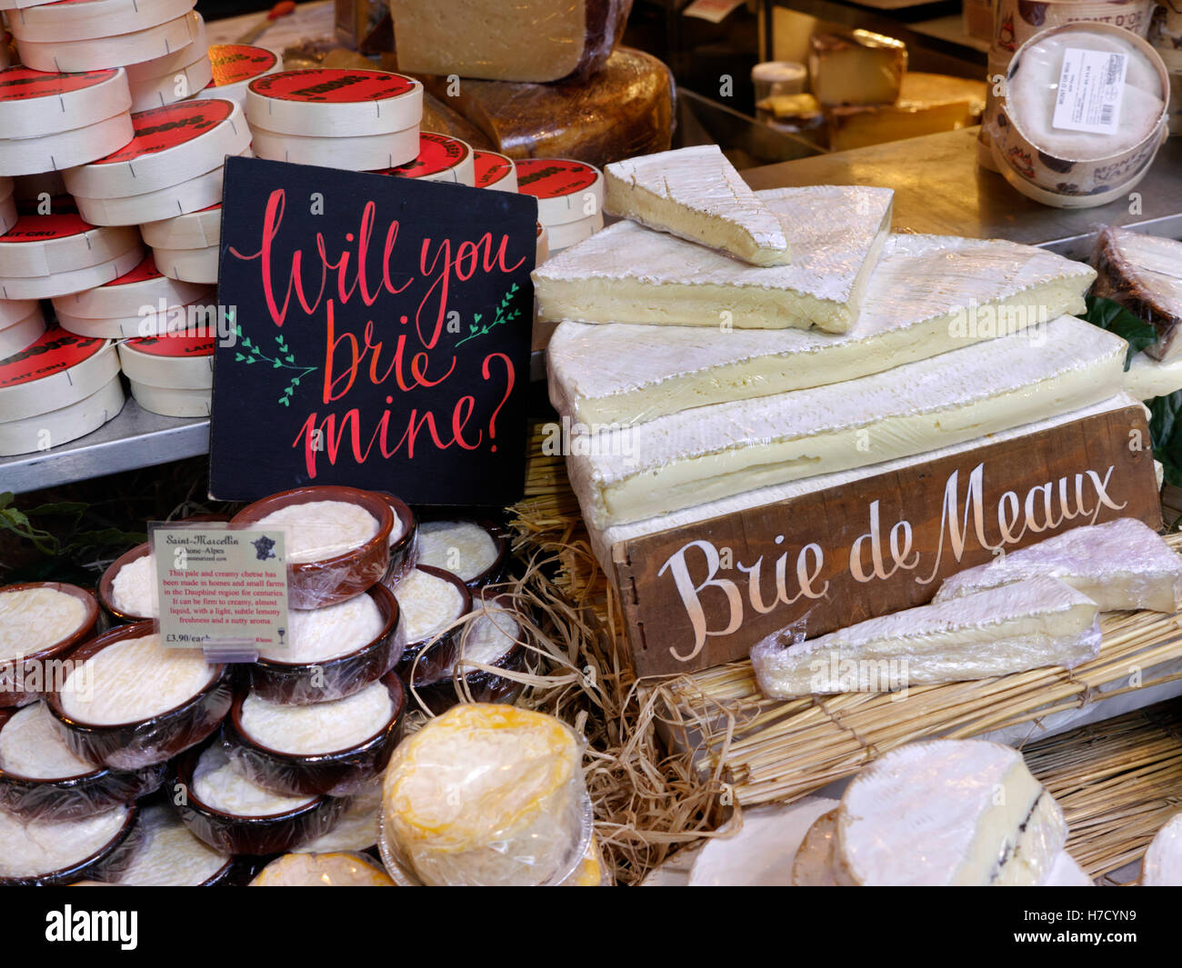 BRIE DE MEAUX with other cheeses featured in authentic (quirky) French cheese stall in Borough