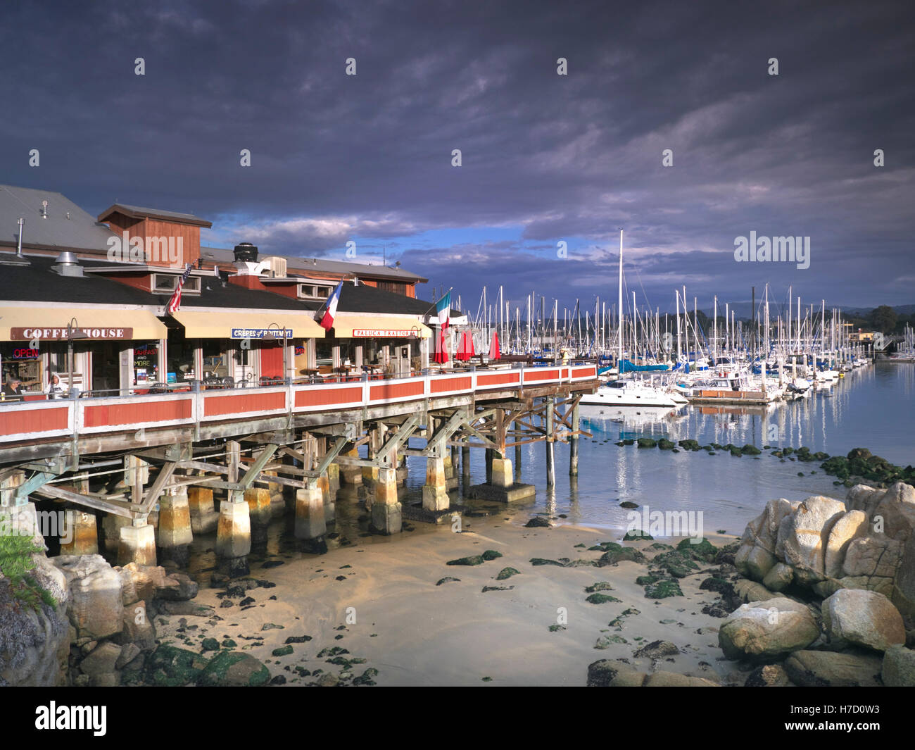 Sun setting on Fisherman's Wharf a historic wharf in Monterey, with restaurants and fish markets California, United States. Stock Photo