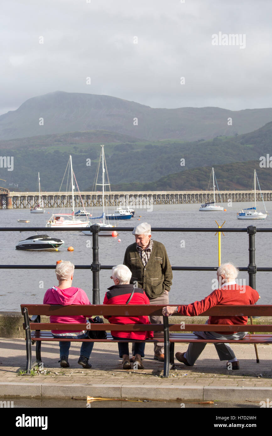 Elderly couples at the seaside town of Barmouth overlooking the Mawddach Estuary , North Wales, UK Stock Photo