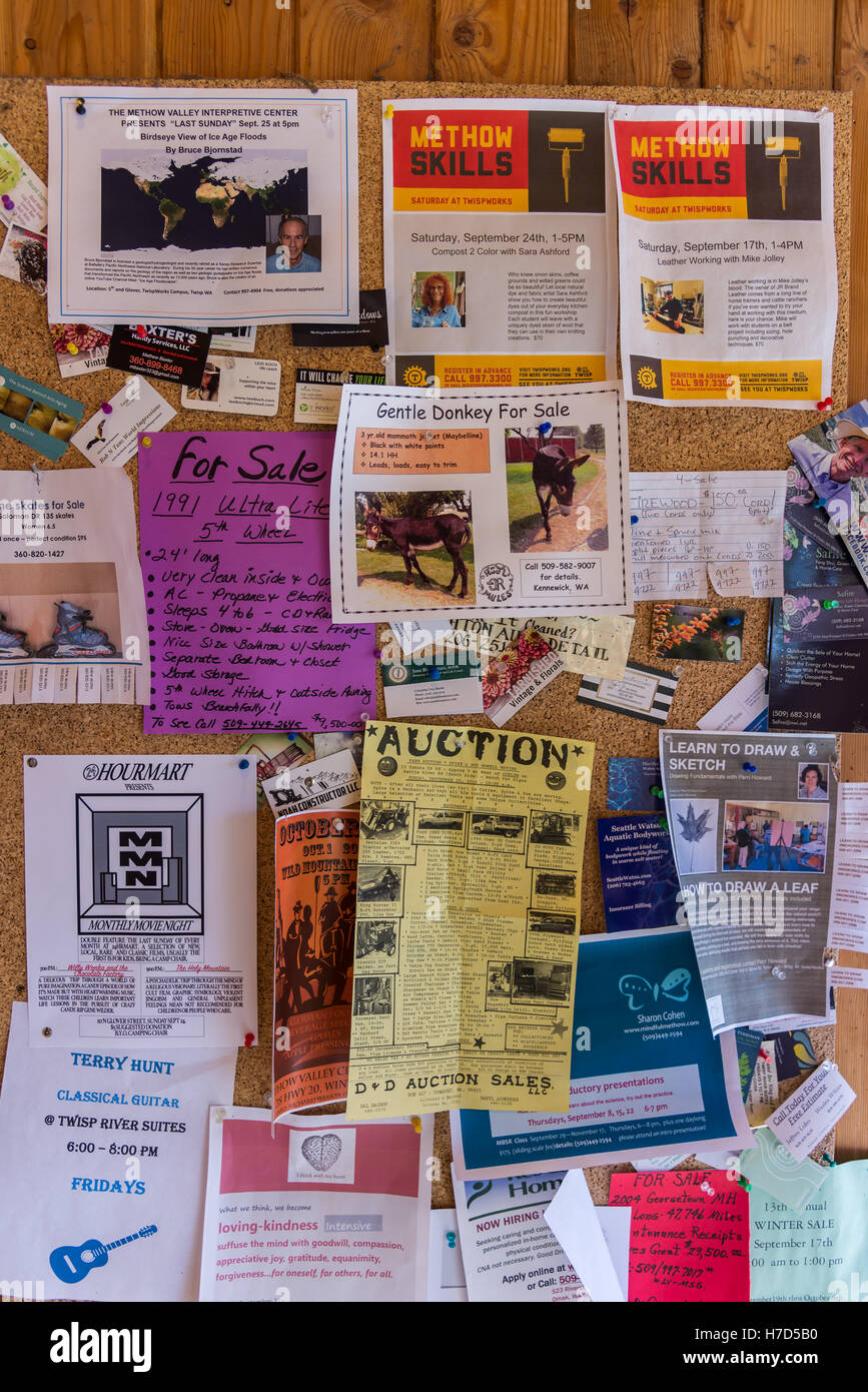 Variety of ads and announcements posted on a bulletin board in small town Twisp, Washington, USA. Stock Photo