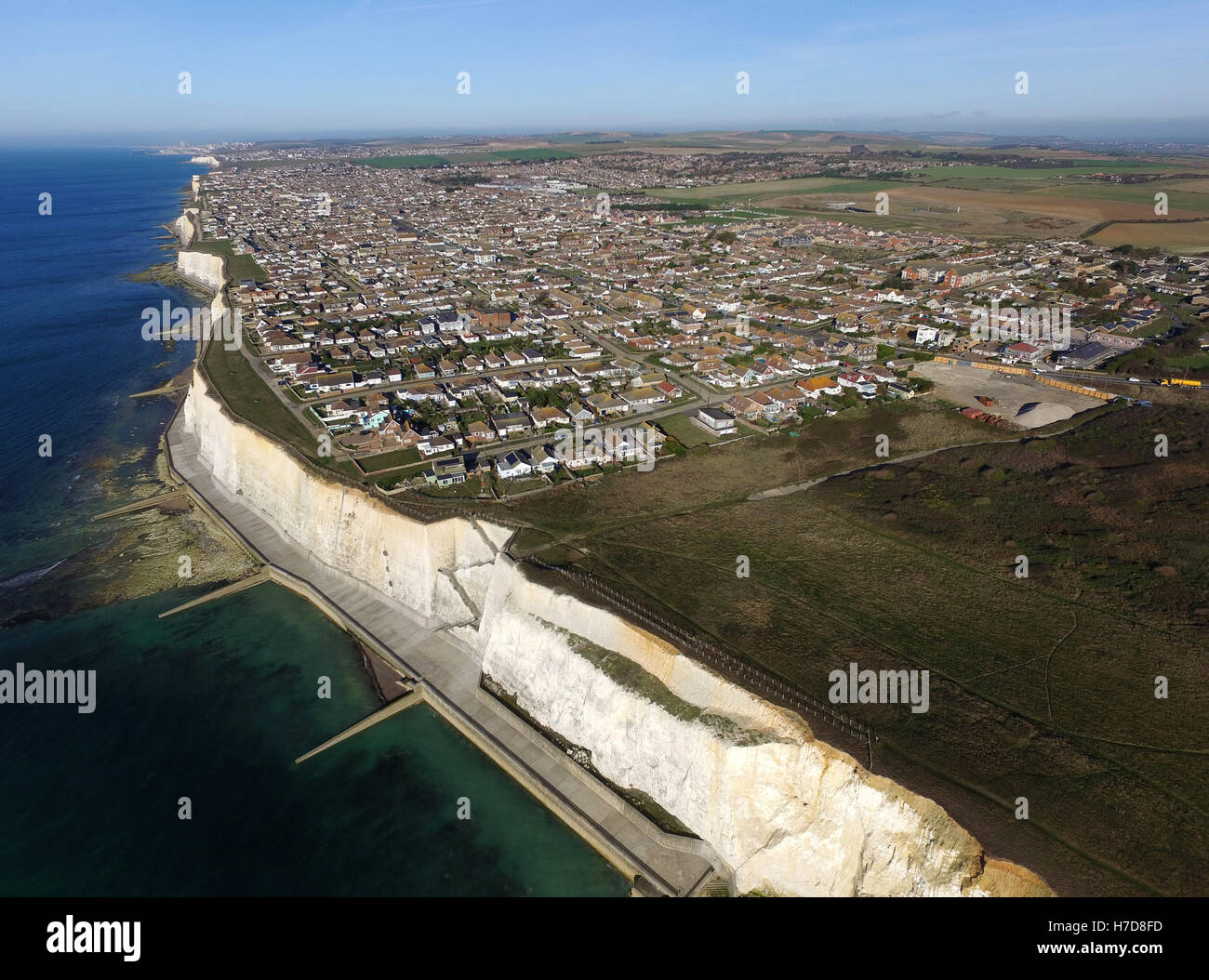 Aerial view of Peacehaven, East Sussex, a small seaside town perched on top of chalk cliffs near the South Downs National Park Stock Photo