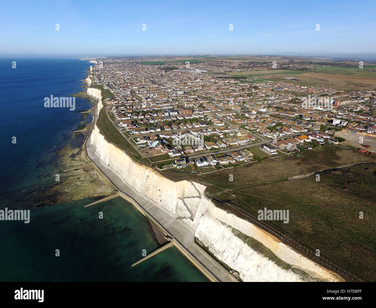Aerial view of Peacehaven, East Sussex, a small seaside town perched on top of chalk cliffs near the South Downs National Park Stock Photo