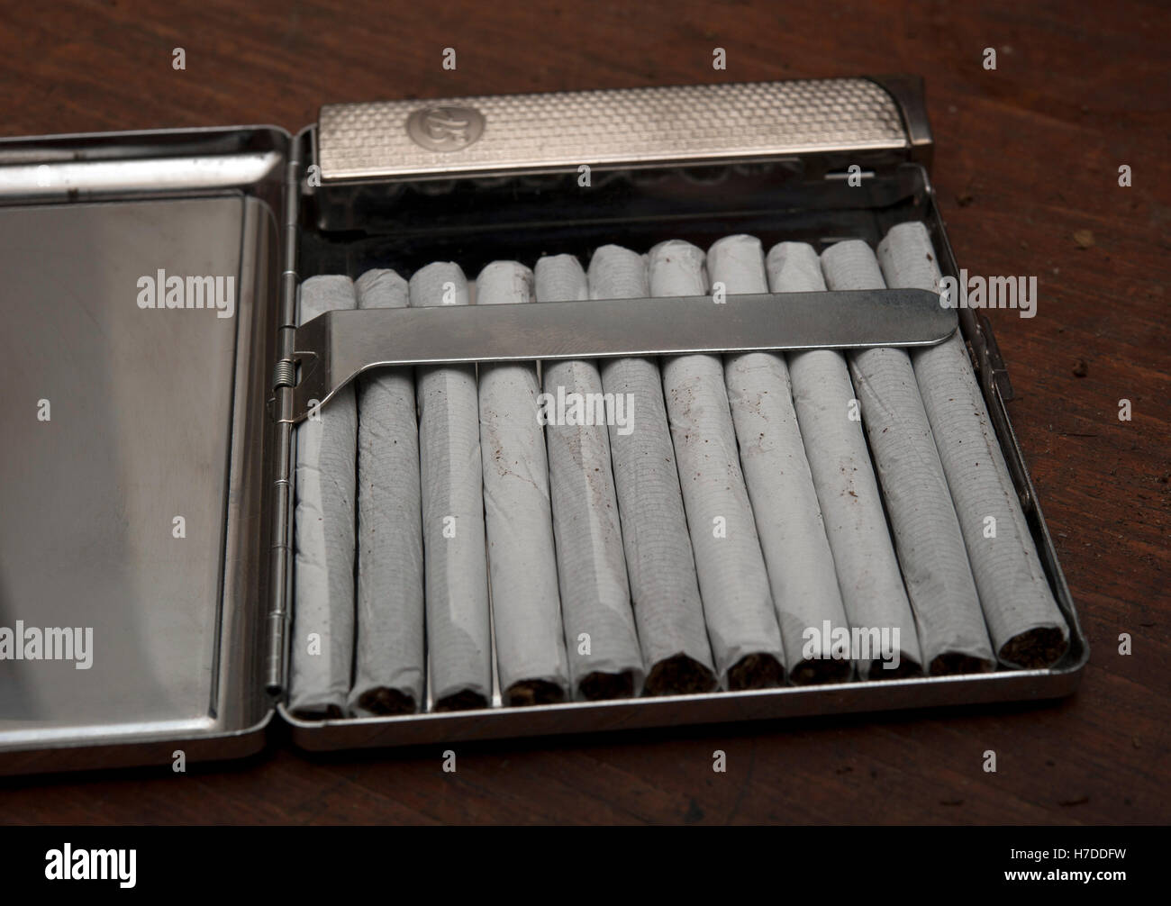 Cigarettes in a case with lighter Stock Photo Alamy