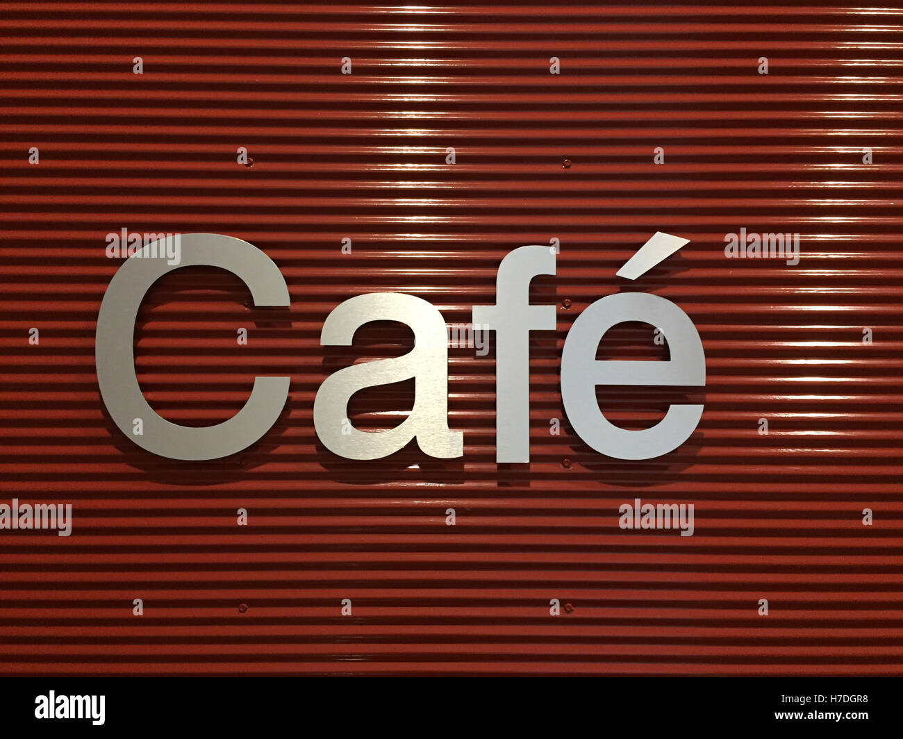 Stylish cafe sign on red metal background closeup Stock Photo - Alamy