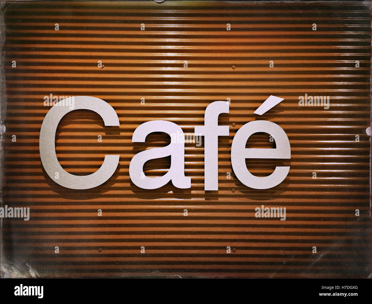 Stylish café sign on orange metal background closeup. Image has vintage effect. Stock Photo