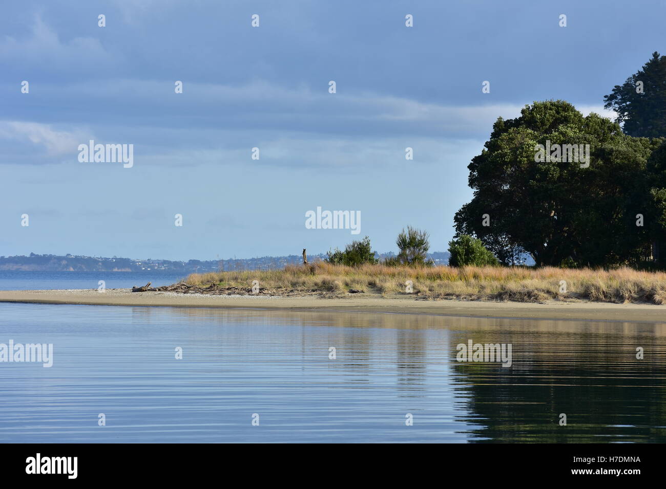 Mirror-like sea in the mouth of an estuary. Stock Photo