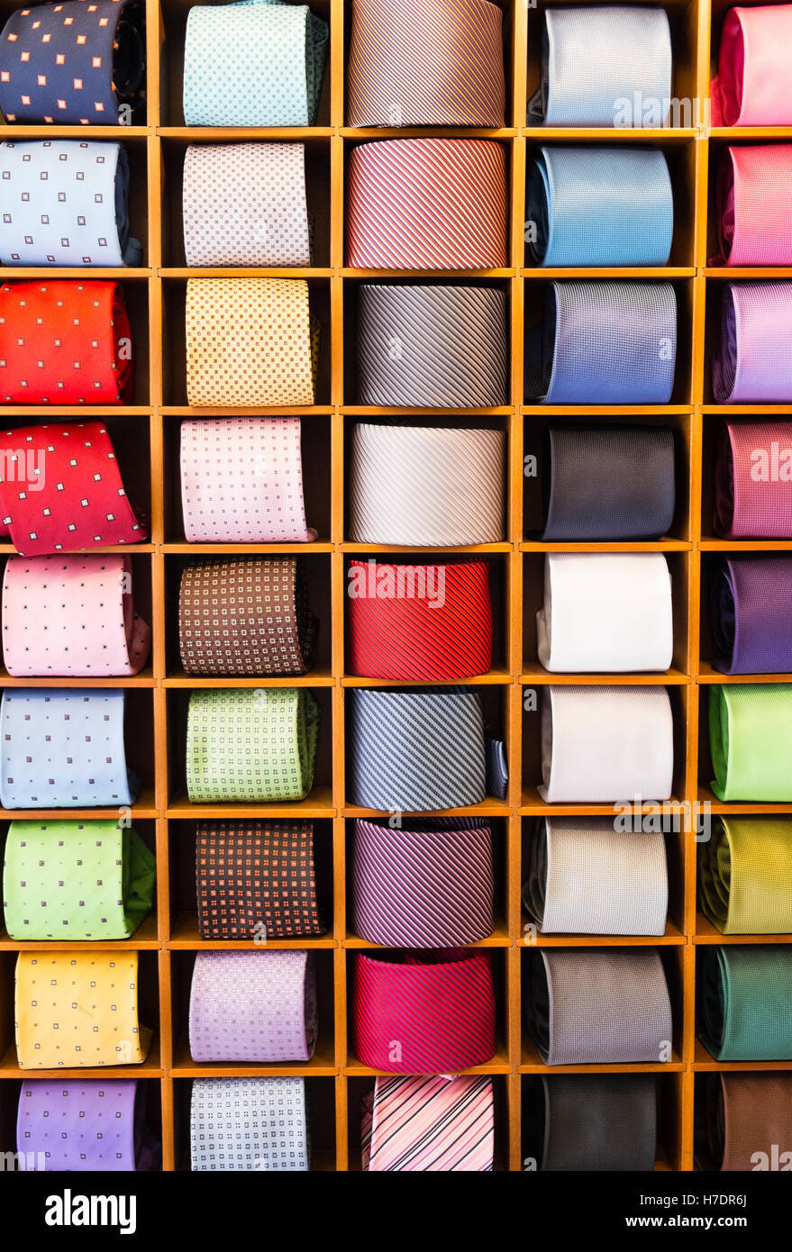 A retail display of mens neckties showing varied colors, patterns and fabrics. Stock Photo