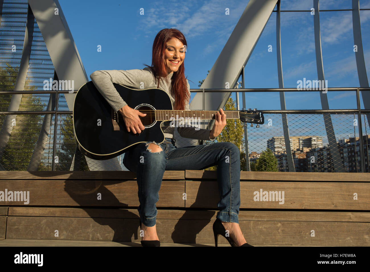 Attractive Smiling Musician Posing With Acoustic Guitar Free Stock Photo  and Image 219218850