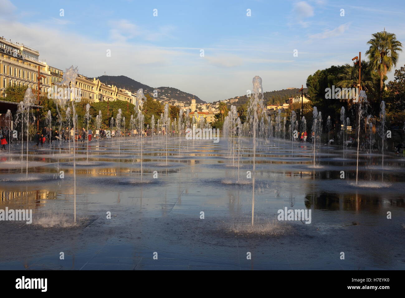 Water feature in Nice city center. Jets of water from a paved area which you can walk between. Stock Photo