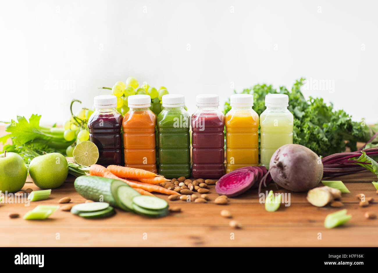 bottles with different fruit or vegetable juices Stock Photo Alamy