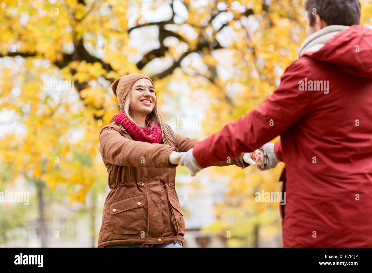 happy young couple having fun in autumn park Stock Photo - Alamy