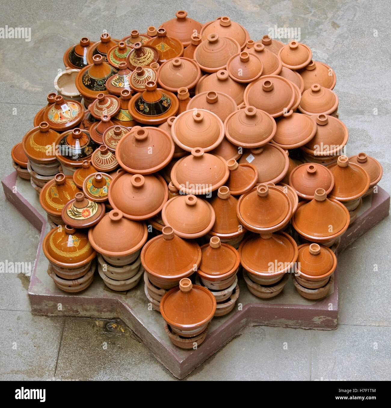 Stacked Moroccan tagine cookware in the Old Fez market in Fez, Morocco