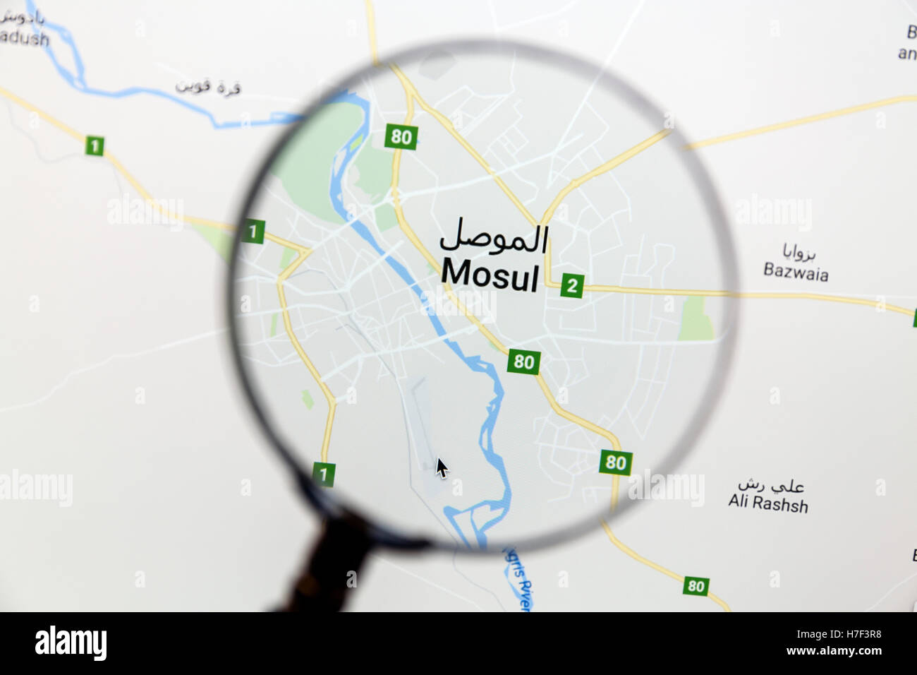 Map of Mosul on Google Maps under a magnifying glass Stock Photo