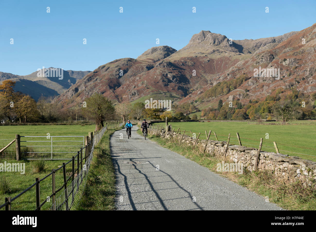 A couple cycling in the Langdale Valley, Lake District, UK. Stock Photo