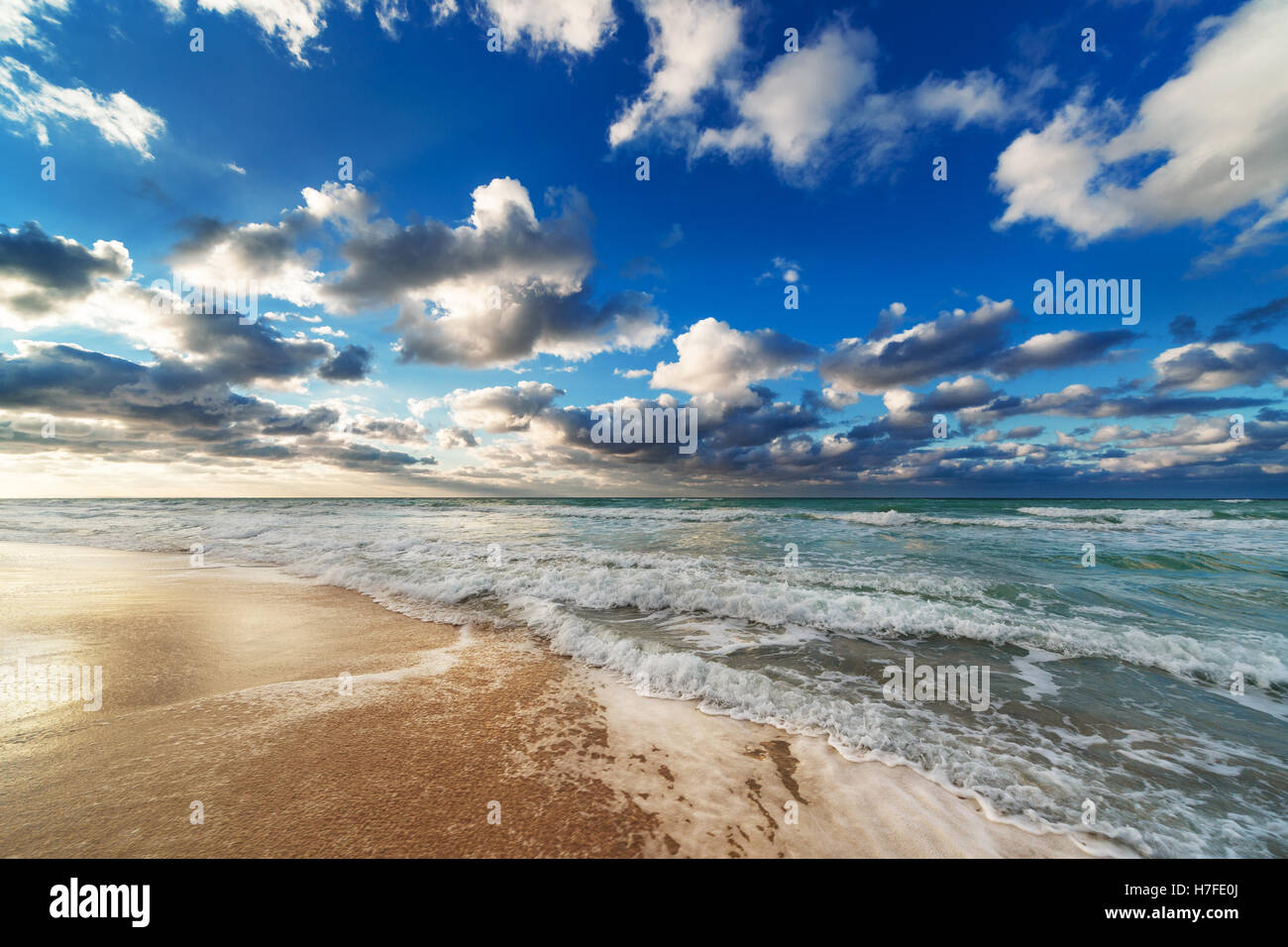 Sunrise on beach water waves hi-res stock photography and images - Alamy