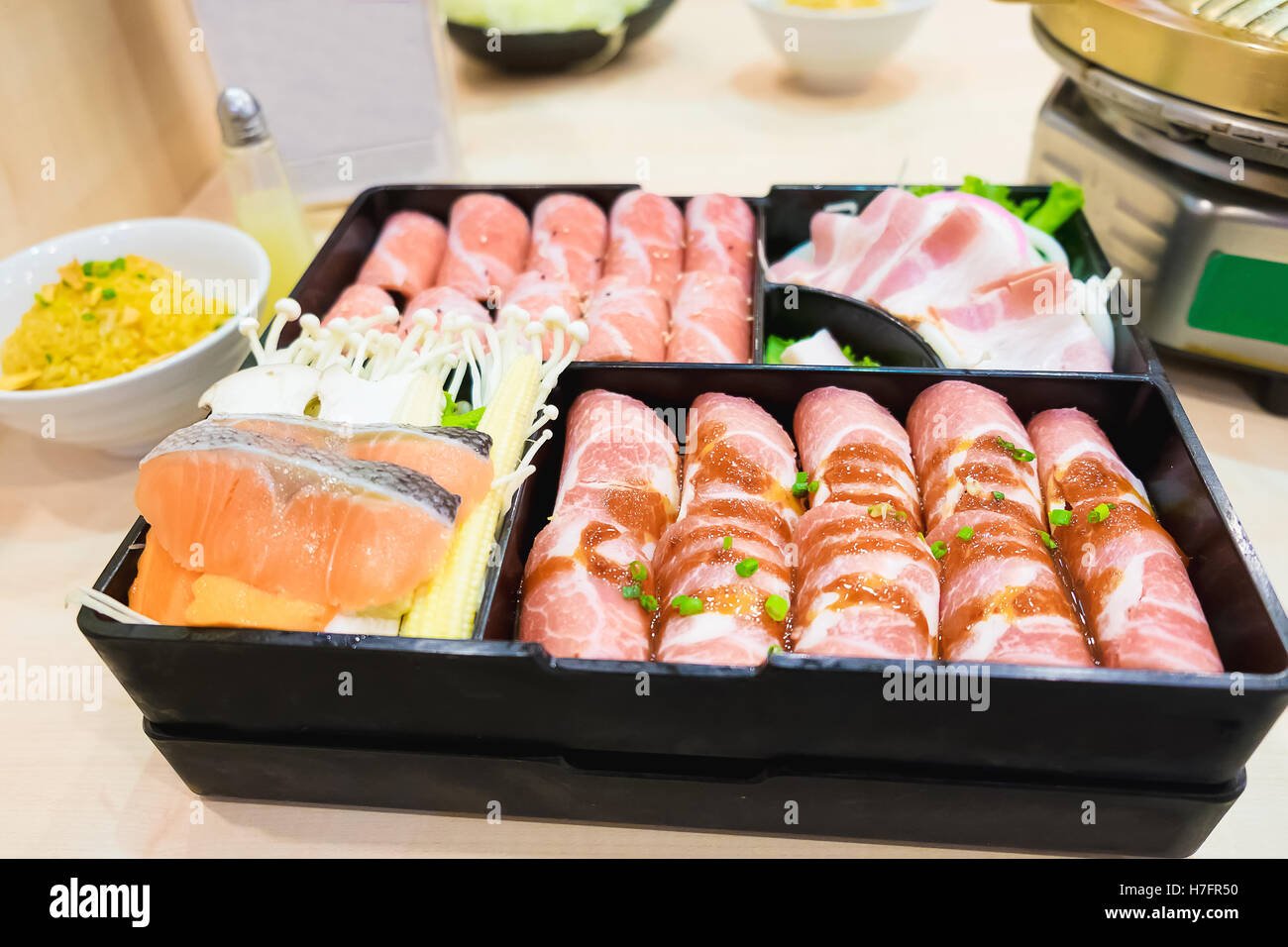 Raw kurobuta pork slices on plates, for sukoyaki and yakiniku hot pot