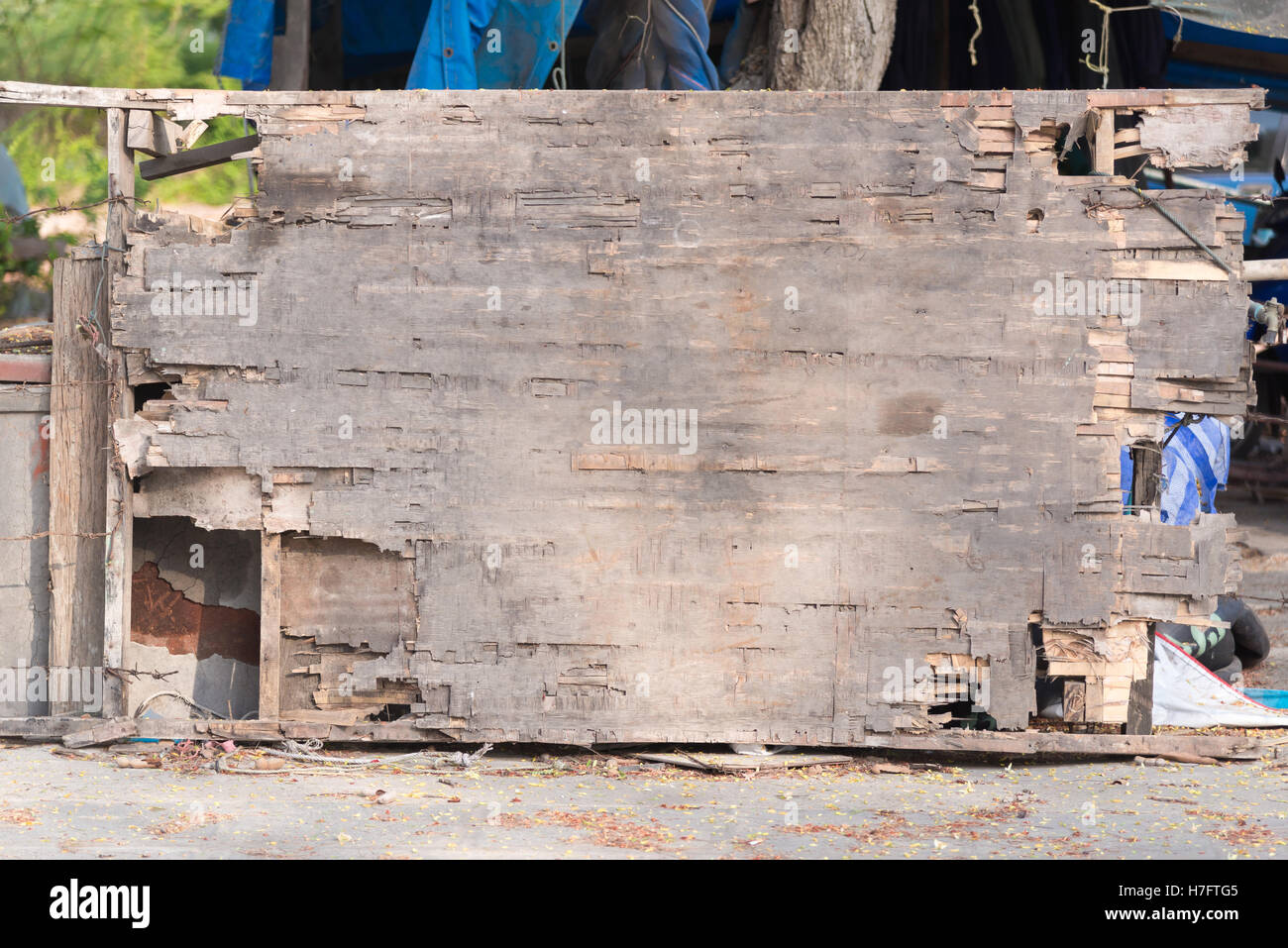 Old weathered plywood, damaged plywood wall background and texture