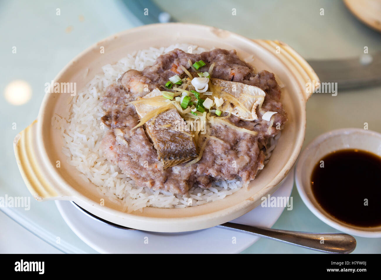 Chinese steamed pork with salted fish rice in claypot is a popular dish in Cantonese dim sum restaurants in Hong Kong. Stock Photo