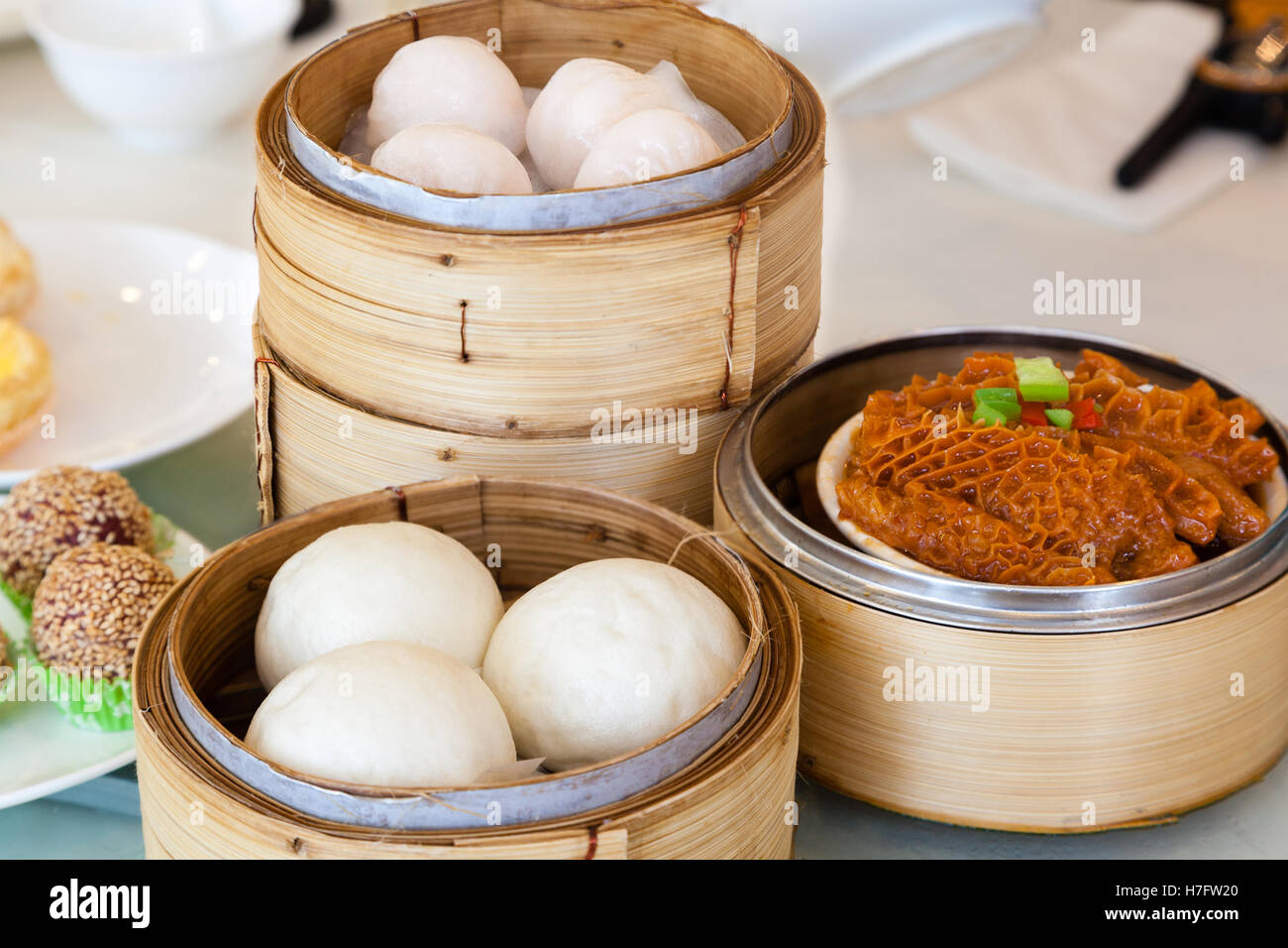 steamed chinese dim sum served in bamboo steamers including buns