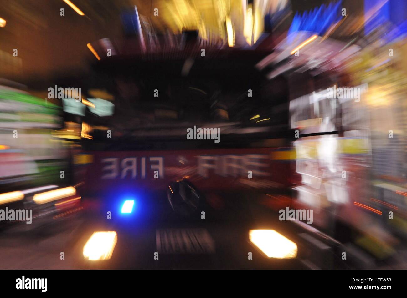 A fire engine races to an emergency through central London Stock Photo ...