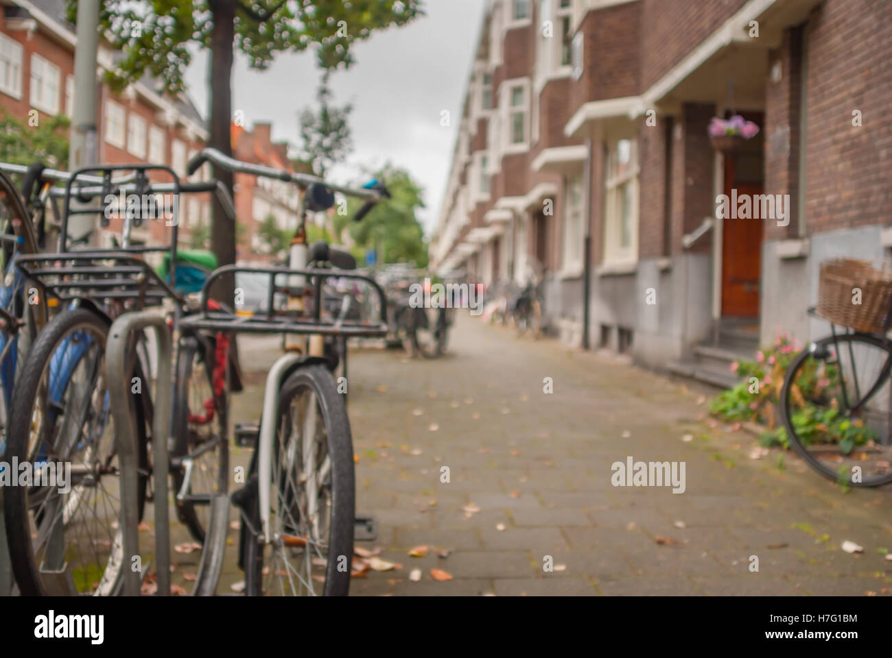 Blurry background - small street of Amsterdam city with bicycles at ...