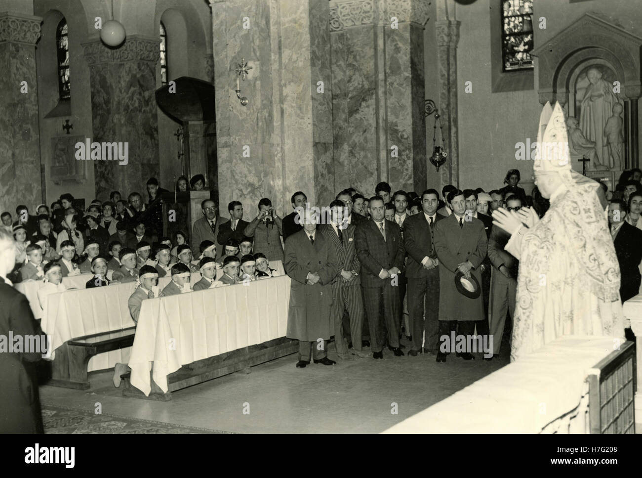 Children in the church waiting for the first communion, Italy Stock ...