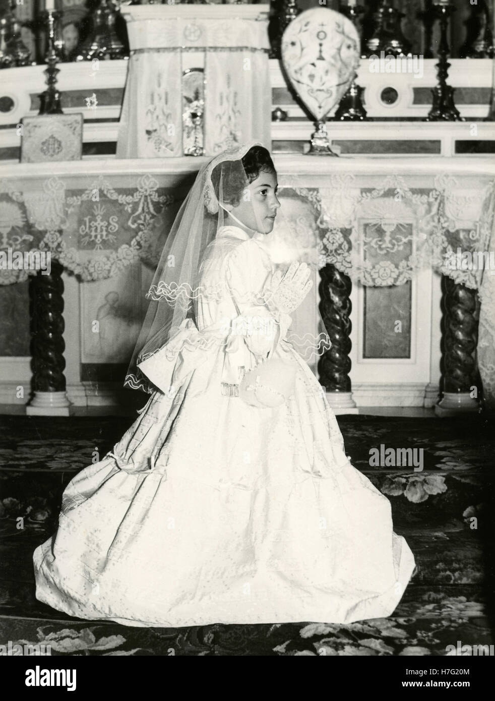 Girl dressed for her first communion, Italy Stock Photo - Alamy