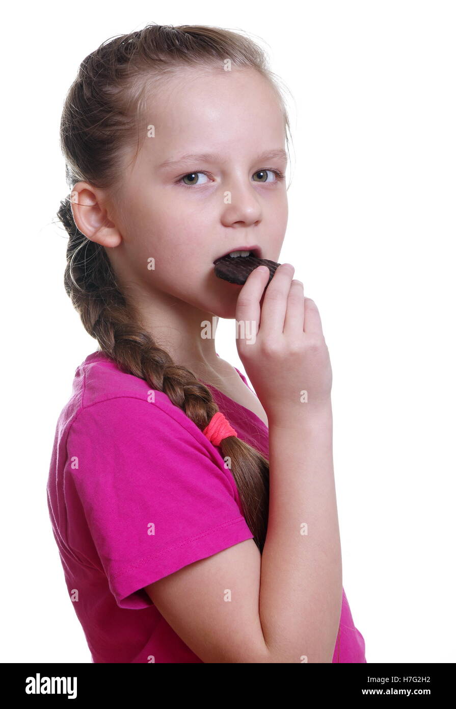 pretty girl eating chocolate bisquit Stock Photo - Alamy