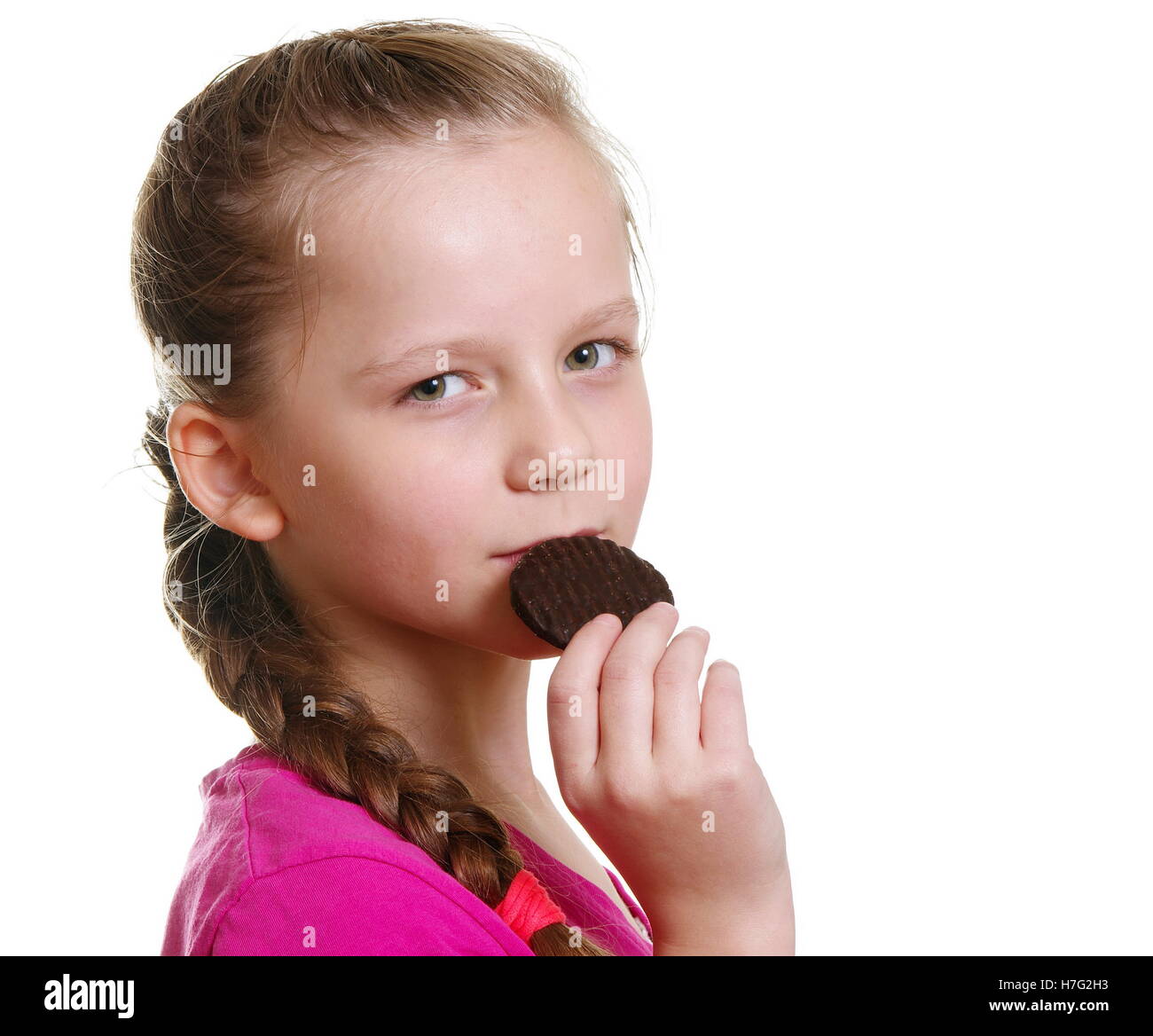 pretty girl eating chocolate bisquit Stock Photo - Alamy