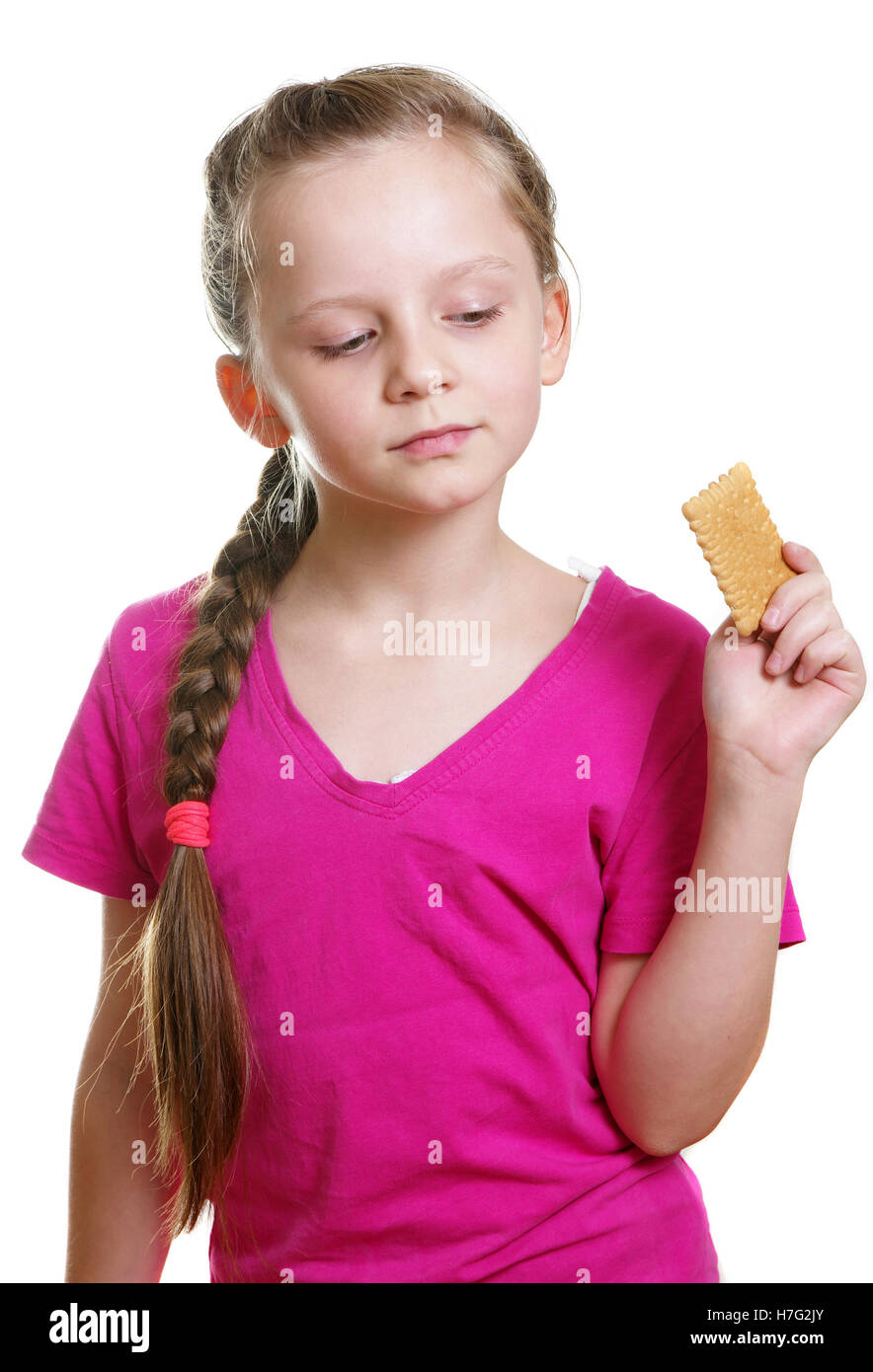 pretty girl eating bisquit Stock Photo - Alamy