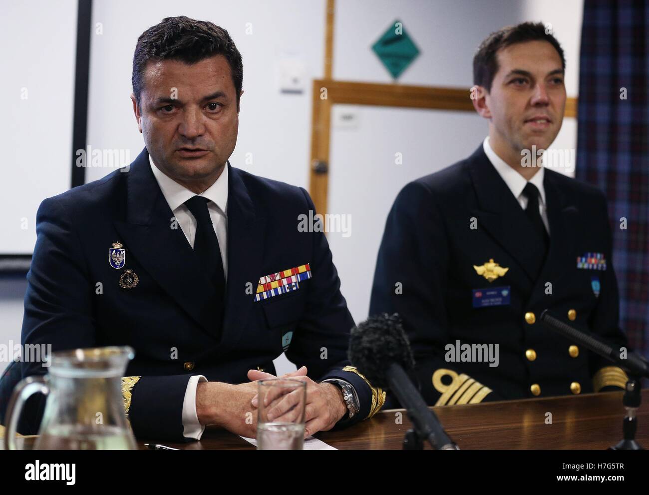Rear Admiral Jose Enrique Delgado (left) speaks during a press conference aboard HMS Duncan, as four Nato warships have docked in Belfast after monitoring a Russian aircraft carrier through the North Sea and on to the Mediterranean. Stock Photo