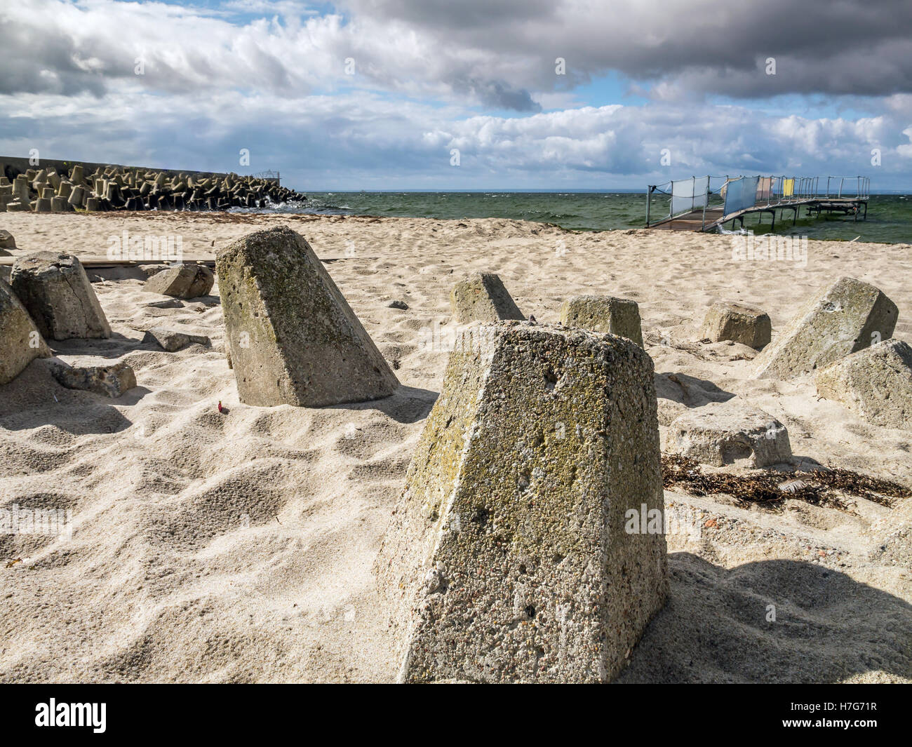 Massive concrete breakers on the beach Stock Photo