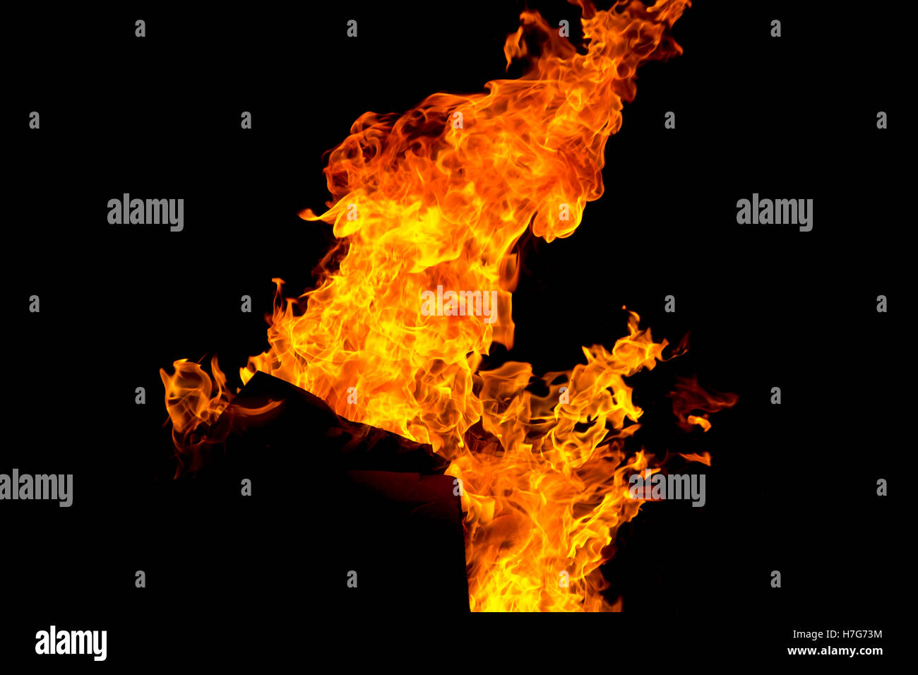 Photo of red fire flame on black background Stock Photo - Alamy