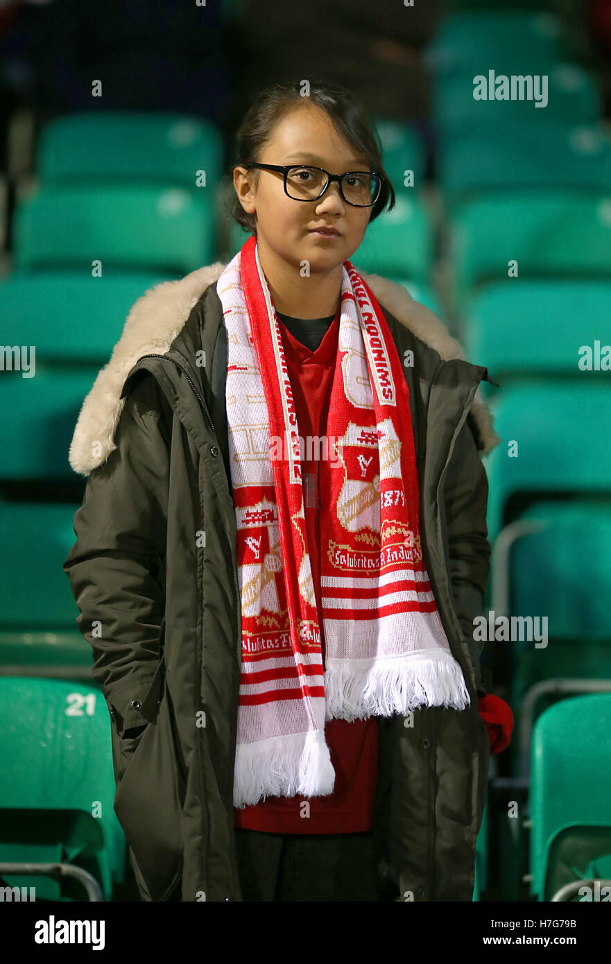 A Swindon Town fan in the stands prior to the Emirates FA Cup first round match at Silverlake Stadium, Eastleigh. Stock Photo