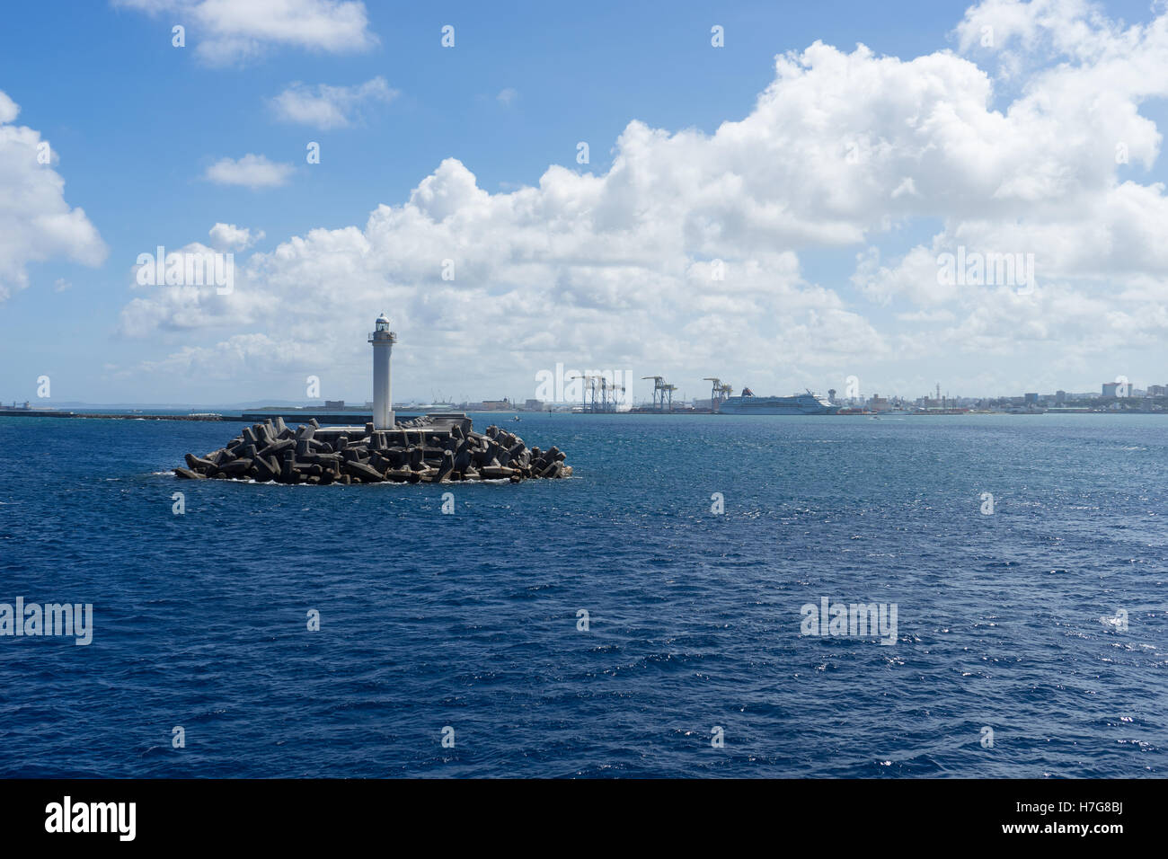 Lighthouse on a sea defence platform in Okinawa Stock Photo