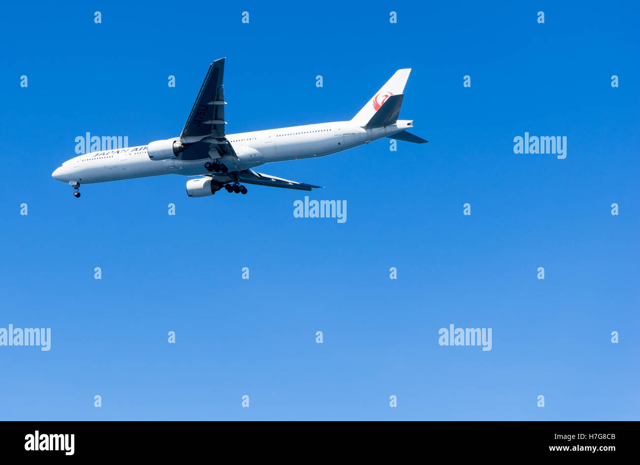Japan Air, flight on a clear sky Stock Photo