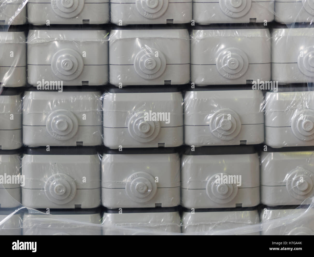 Plastic electrical distribution box, bulk, packed in foil Stock Photo