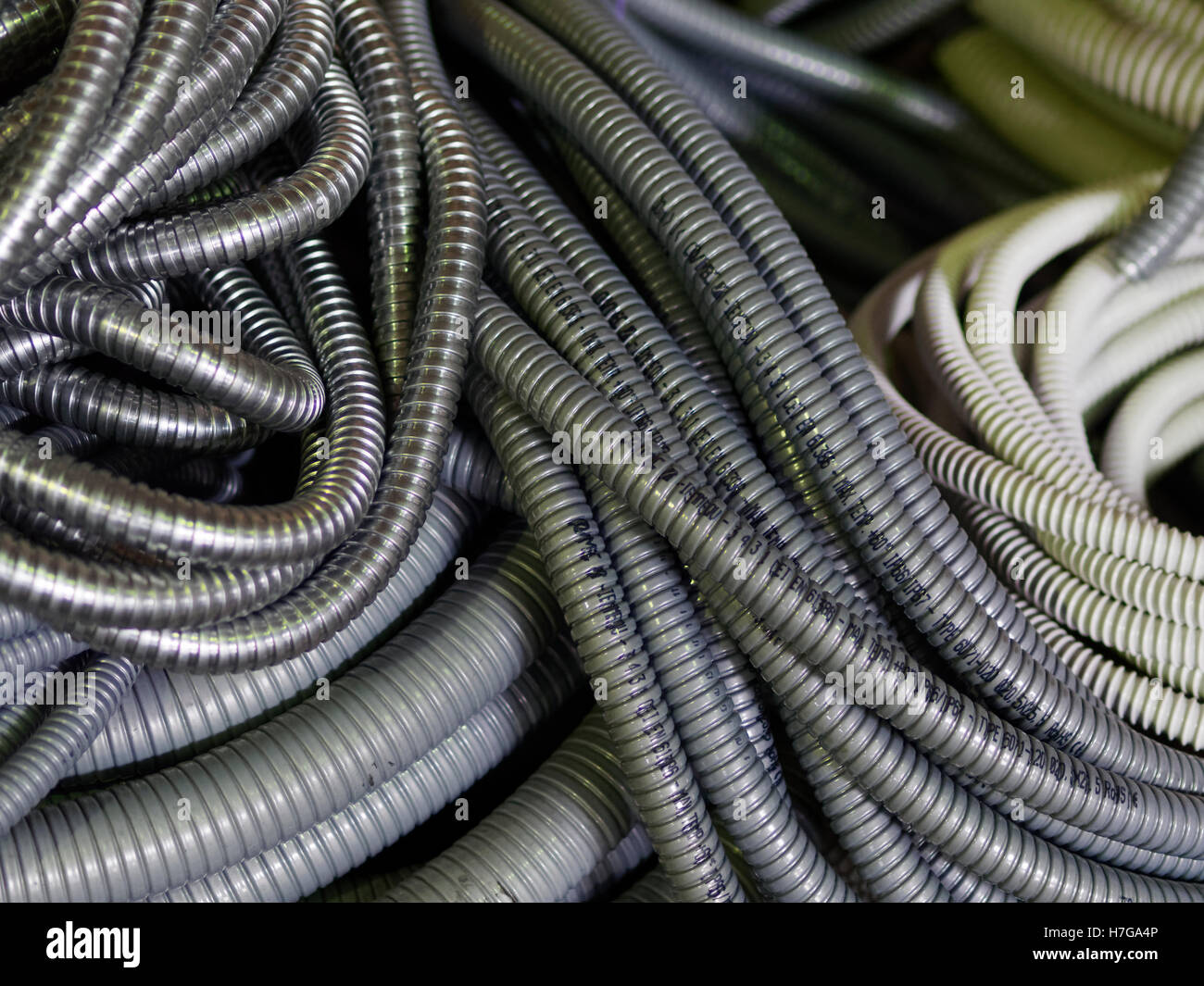 Various cable management flexible hoses Stock Photo