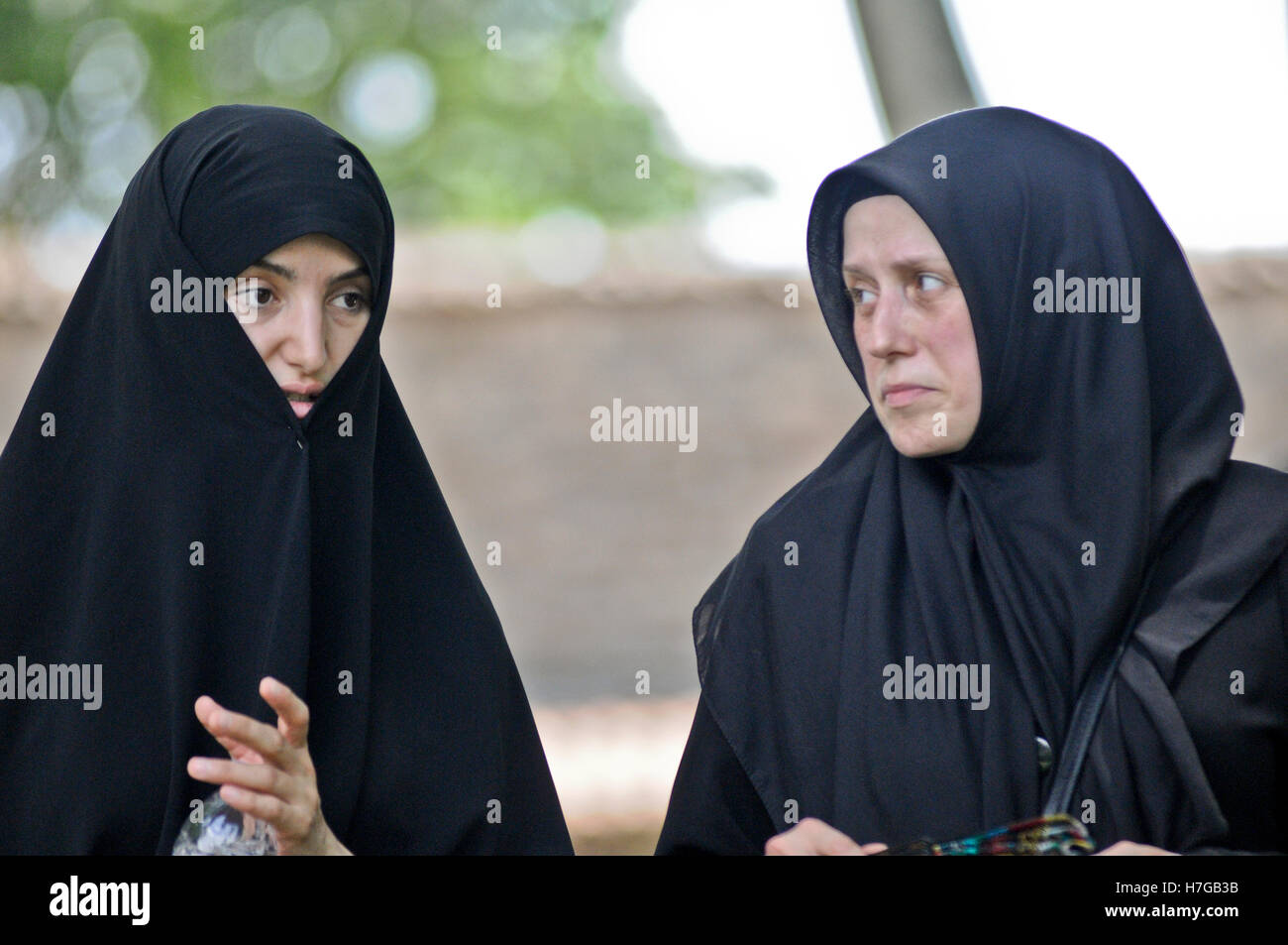 Muslim women wearing black burka and hijab. Istanbul, Turkey Stock Photo
