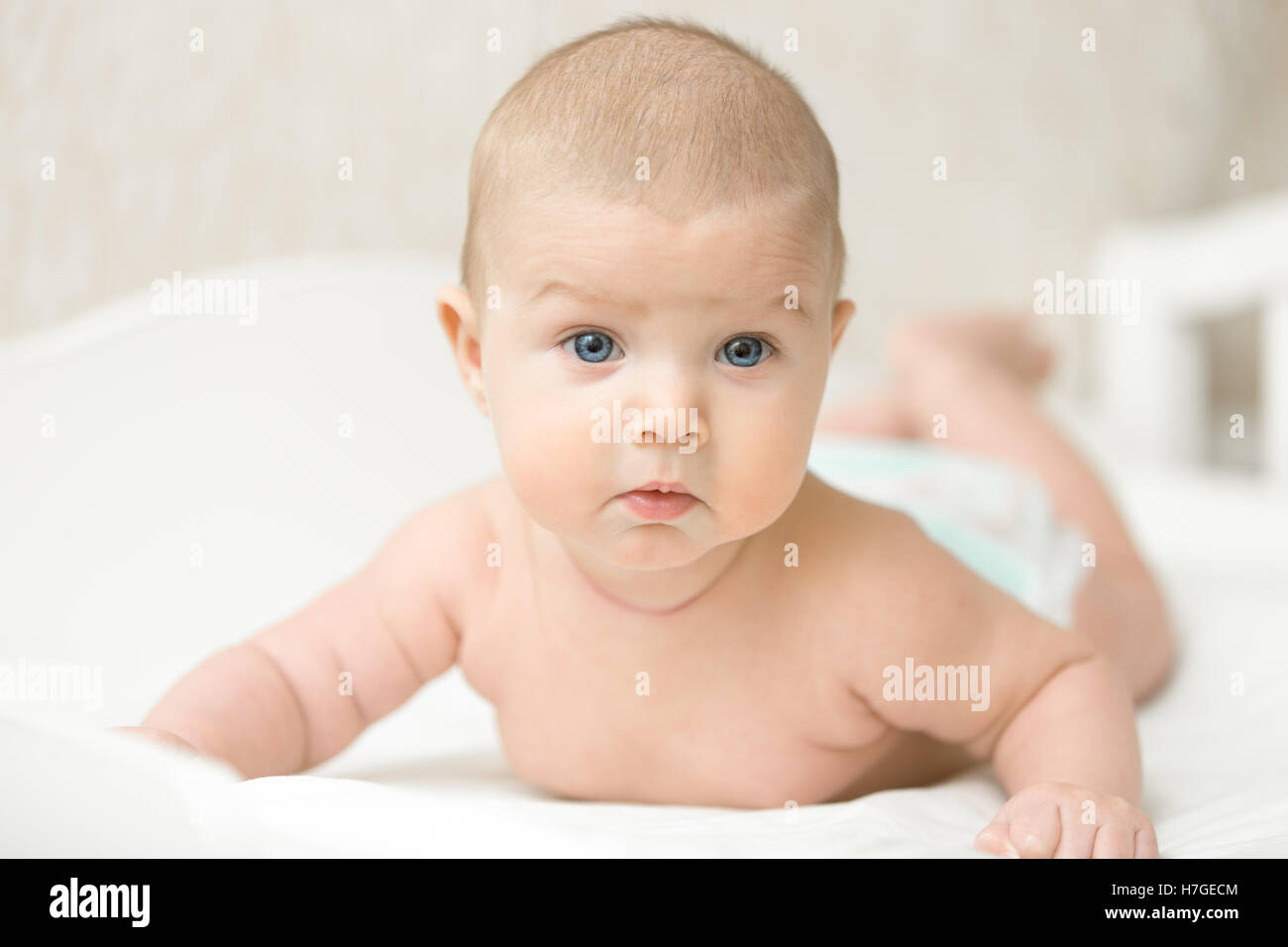 Portrait of a cute baby making questionable funny face Stock Photo
