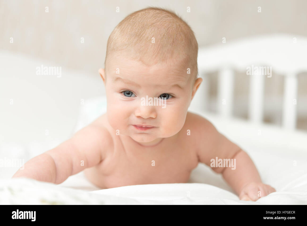 Cute baby gets on arms Stock Photo Alamy