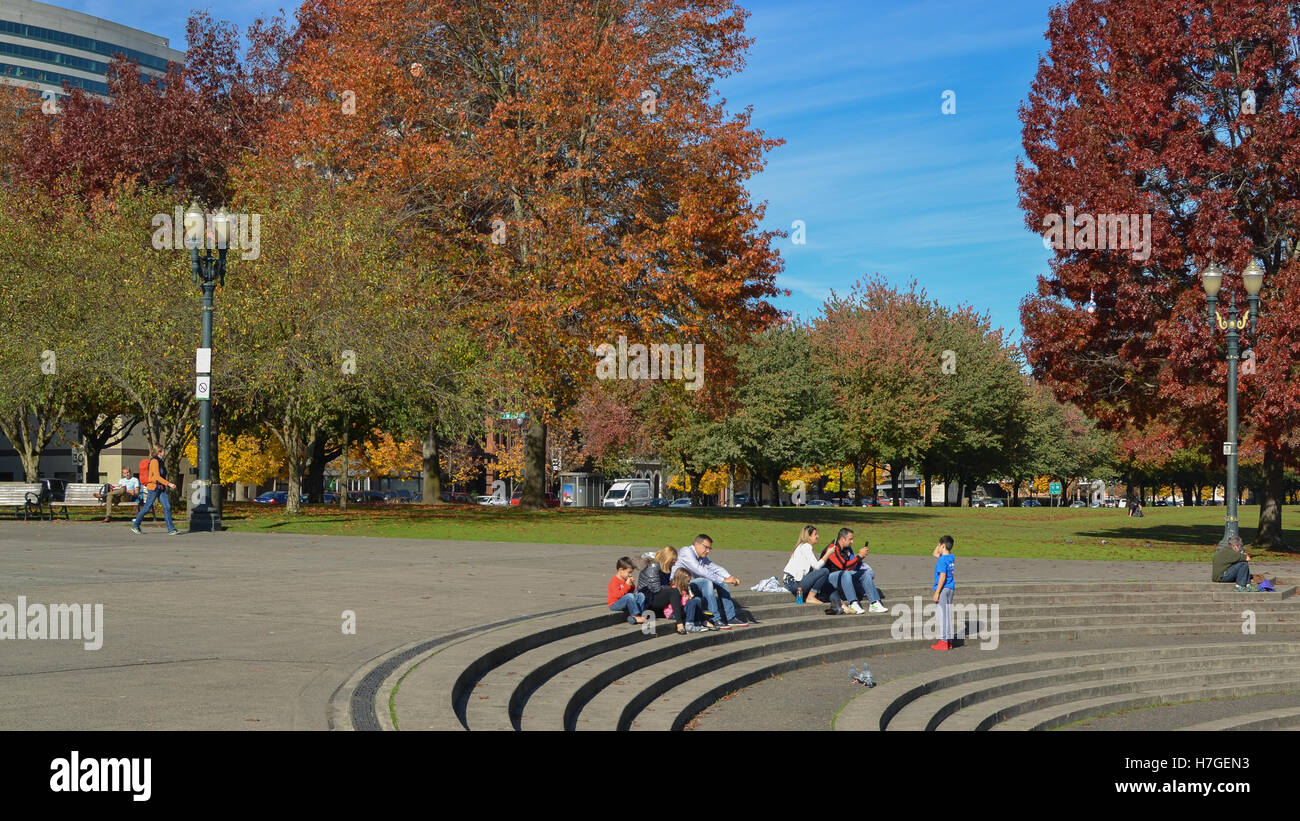 Unidentified people enjoying  Portland’s Governor Tom McCall Waterfront Park on sunny Autumn day. Stock Photo