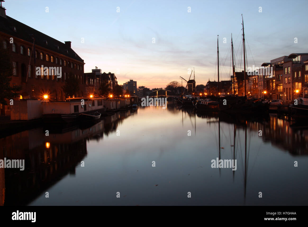 Old Fishing Boats, Galgewater Bridge, Canal, Houses, Leiden, Netherlands Stock Photo