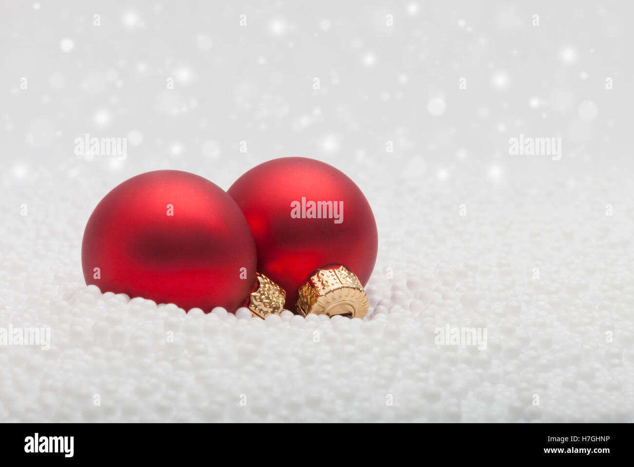 Christmas ornaments in fake snow Stock Photo Alamy