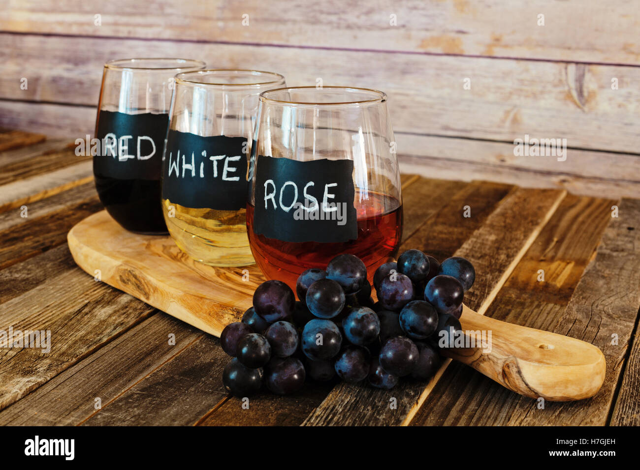 Three color wine flight in label glasses close up Stock Photo Alamy