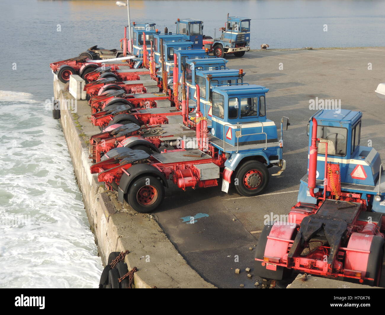 Tow trucks waiting at the harbor. Stock Photo